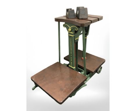 A set of antique John White & Sons weighing scales with two weights.