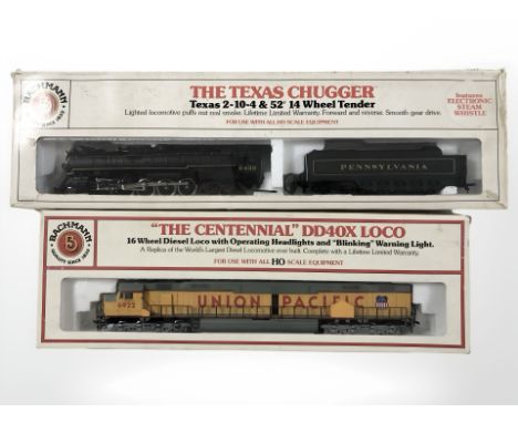 Two Bachmann HO scale locomotive engines including The Centennial DD40X loco and The Texas Chugger 2-10-4.