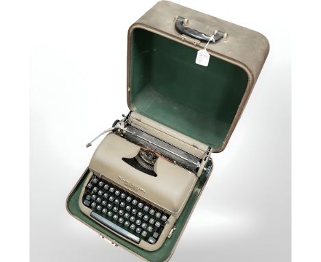 A Remington "Quiet-Riter" vintage typewriter, in carry case. 