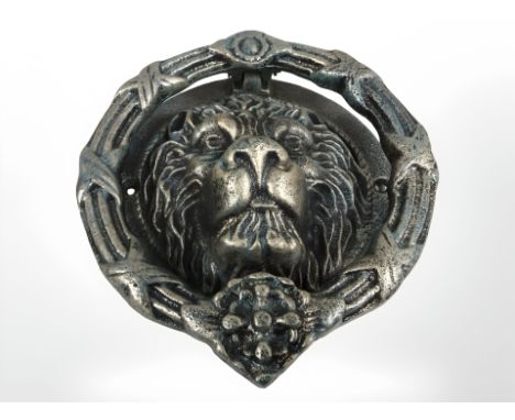 A lion head door knocker.