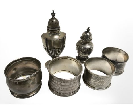 Four antique silver napkin rings, together with two silver pepper pots. CONDITION REPORT: Gross weight: 121.8g. 