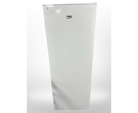 A Beko fridge, together with the user manual. 