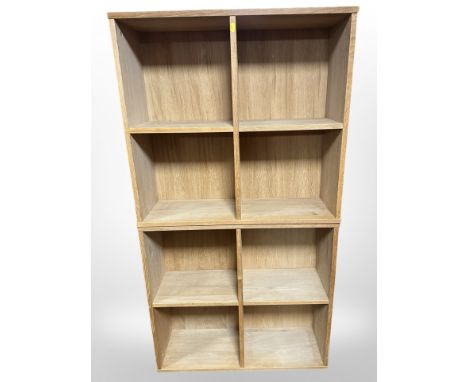 A pair of light oak bookcases, width each 75 cm.