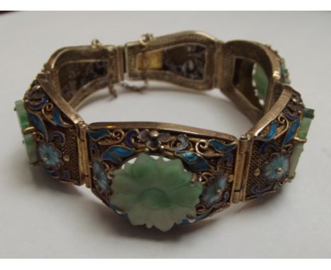 Chinese vintage guilt filigree sterling silver enameled jade/jadeite bracelet. Features 4 pieces of hand carved jadeite and e