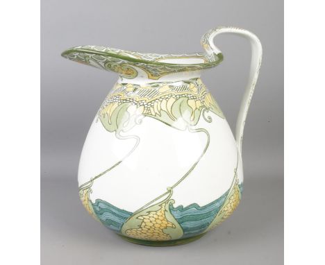 A Doulton Burslem 'Kelmscot' water jug, decorated with water lilies. Height: 23cm.  Generally good condition. Fading to print