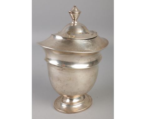 An Edwardian silver tea caddy inscribed 'Malo Mori Quam Fiedari'. Assayed London 1905. 292g.  