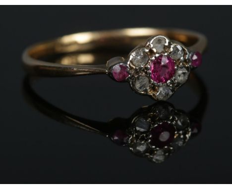 An 18ct Gold Ruby and Diamond cluster ring. Size O. Total weight: 1.7g.  