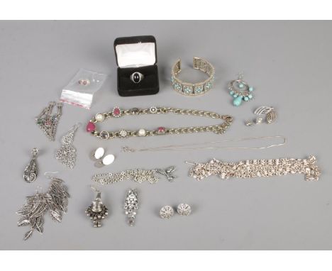 A collection of white metal costume jewellery to include one silver ring, assorted necklaces, earrings, etc.  