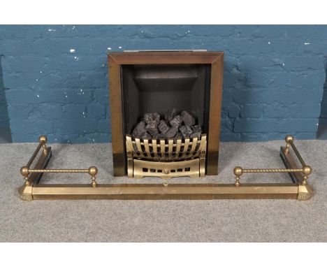 A 'Fuel Effect Fires Ltd' gas fire, with surround, grate and extending fender.  