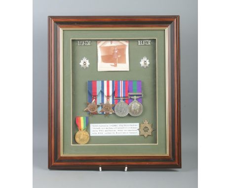 A framed collection of medals and badges awarded to Corporal, later Staff Sergeant Walter Hopkins. Served through Duke of Cor