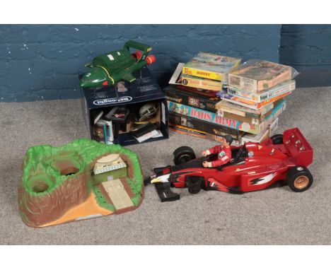 A collection of children's toys and games to include Dad's Army board game, Thunderbirds, jigsaw puzzles, diecast vehicles, e