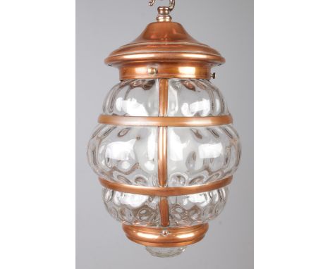 A hanging copper mounted lantern with bubble effect glass panels. With wall mounted hook fixture. Height of lantern: 33cm.  