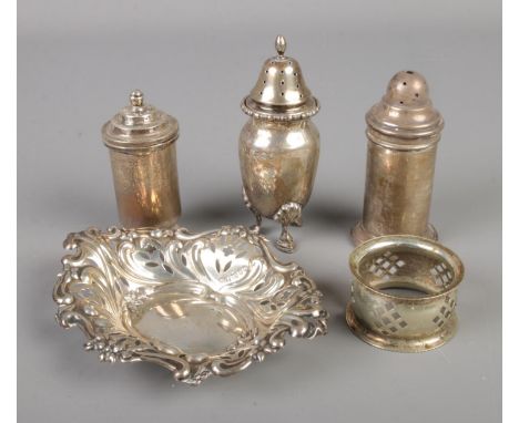 A small collection of silver. Includes pierced trinket dish, salt shakers, napkin ring. 180g.  