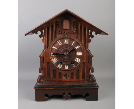 A Black Forest cuckoo clock, with roman numeral dial, chiming on a coiled gong. Movement stamped for GHS (possibly Gordian He