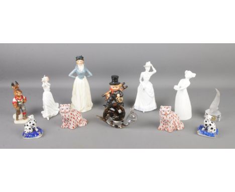 A collection of ceramic and glass figures, including Royal Doulton 'Thinking of You', a pair of continental cat figures, Goeb