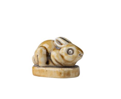 A delightful Royal Doulton stoneware figurine of a bunny, designed by the esteemed artist Mark V. Marshall. This charming pie