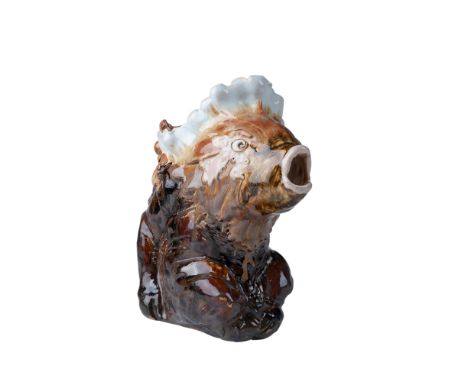 This exceptional antique stoneware pitcher showcases the distinctive work of Mark V. Marshall. The design features a grotesqu
