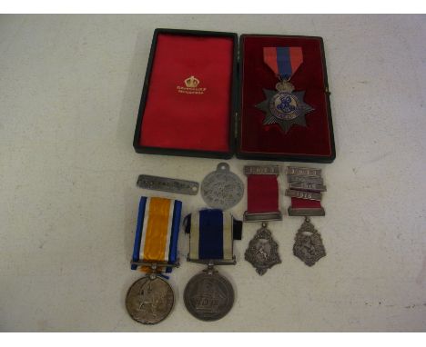 A British War Medal 1914-18 awarded to W H Flaulkes Chief Writer H.M.S. Wildfire, a Royal Navy Long Service and Good Conduct 