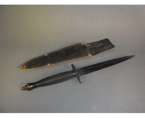 A WWII commando dagger with non original scabbard - Length 31cm - good used condition