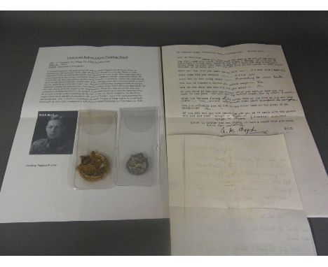 The Army Air Corps sterling silver beret badge and plastic cap badge of Lieutenant Robert O. F. Boyd, gilder pilot who landed