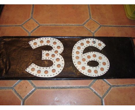 A tram number plate with holes for lighting from behind, numbered 36 - good condition