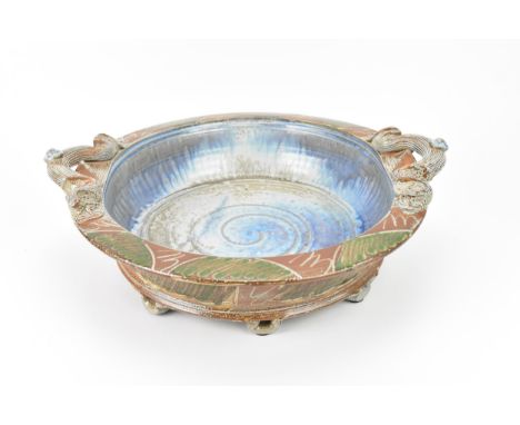 A large salt glazed stoneware basin by Richard Dewar, of circular form with twin handles either side, incised decoration to t