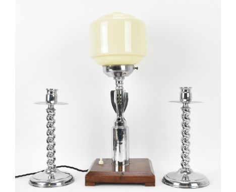 A Smith &amp; Wesson A.B.2/42Z chrome plated shell converted to a table lamp with a milk glass shade and mounted on an oak sq