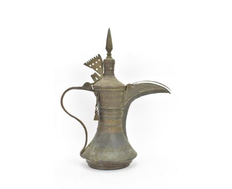 A 19th century tinned copper Dallah coffee pot, having a tapering finial and pierced triangular thumb piece, over a tapering 
