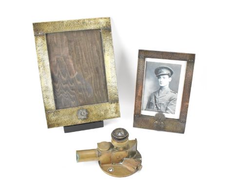 Military related items to include a WWII Tel Elevation No10 MK 1 gun sighting scope, together with two photograph frames, one