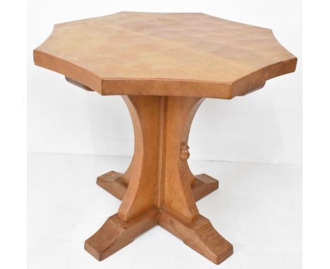 Robert 'Mouseman' Thompson (1876-1955) An oak coffee table, circa 1955, having an inverted curved adzed octagonal top on cruc