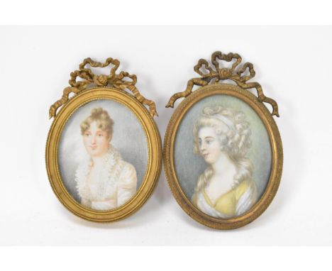 Two French 19th century ivory portrait miniatures each depicting a lady, of oval form in gilt metal frames with bowed ribbon 