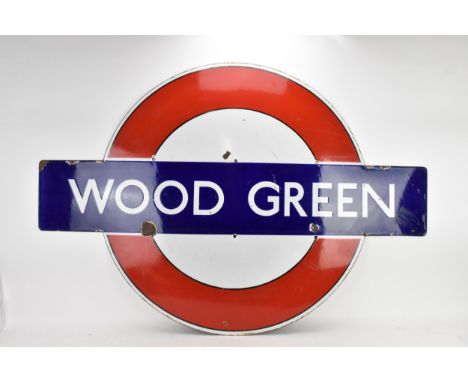 A London Transport Underground enamel target/bullseye sign for Wood Green, pre-war design with black lining out, 149cm x 103c