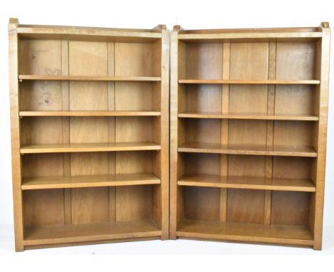 Robert 'Mouseman' Thompson (1876-1955) A matched pair of oak open bookcases, circa 1978, raised upstands, fitted with adjusta