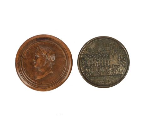 λ Napoleon Bonaparte: a burr wood and tortoiseshell lined circular snuff box, the lid with laureled bust of Napoloeon in reli