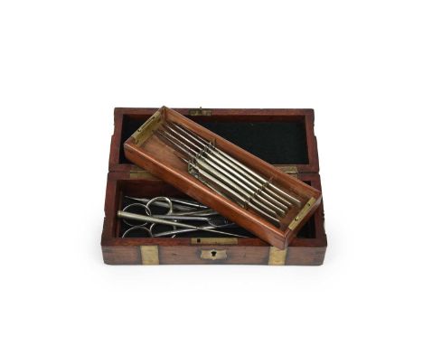 A brass bound oak surgical instrument case by S Maw Son &amp; Thompson, with associated contents including six surgeons knive