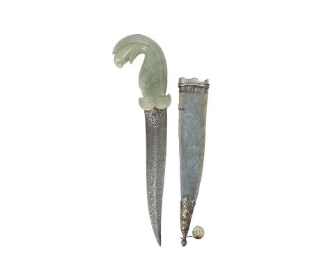 An Indian dagger (khanjar), double edged blade 8.5 in., with silver koftgari embellishment at the base, surface etched to sim