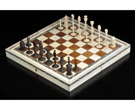 Chess and Backgammon pieces with an articulated board closing in the form of a box, carved ivory, one set of each game dyed b