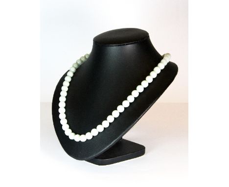 A single strand necklace of celadon jade beads
