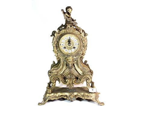 A large ornate brass mantle clock (51cm)