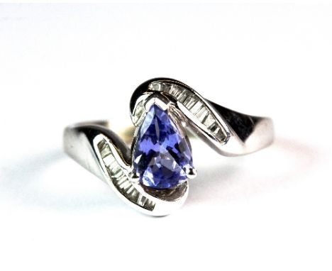 A 9ct gold ring set with a pale tanzanite and diamonds (K.5)