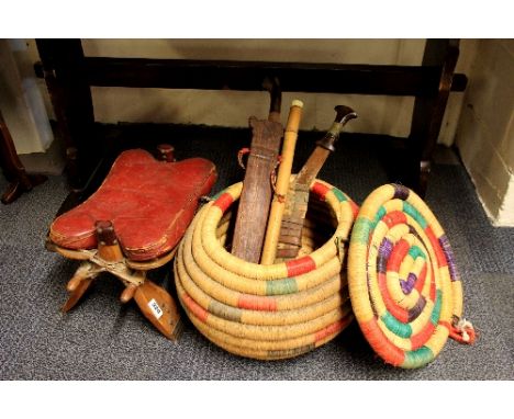 An eastern woven basket, 2 kukri, a bamboo flute and camel saddle stool
