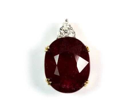 A 14ct gold large ruby and 3 diamond pendant Est. &pound;300 - 500
