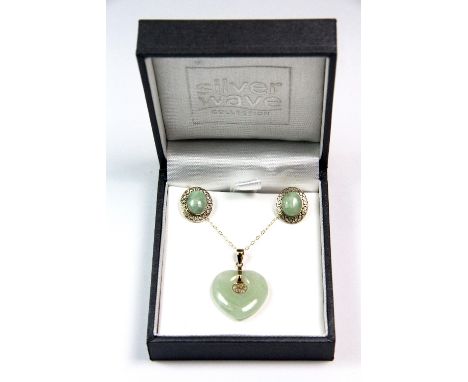 A yellow metal mounted (tested min 9ct gold) jade heart pendant with chain and matching earrings