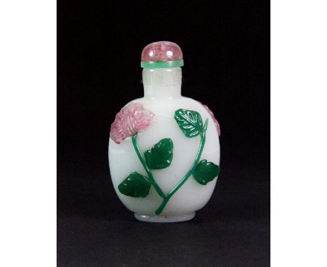 An unusual 19th/early 20thC white glass snuff bottle simulating jade overlaid with green and pink glass with a rose quartz st
