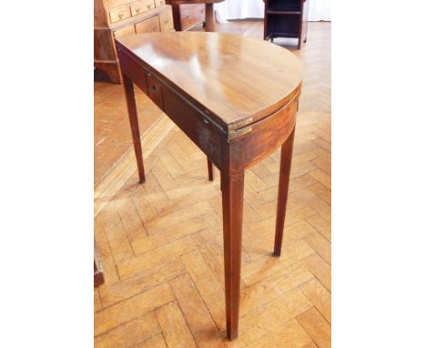 Georgian mahogany demi-lune foldover top card table with double gate supports, green baize lined interior, plain frieze with 