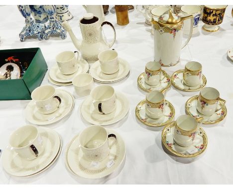 Part coffee service, Nippon including five cups and saucers and a coffee jug, painted with swags of flowers, gilt raised deco