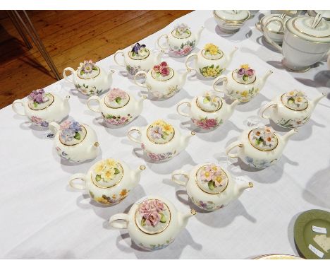 A collection of Royal Stratford "The Country Cottage Teapot" collection including "Anemones", "Sweet Peas", "Sweet Violets", 