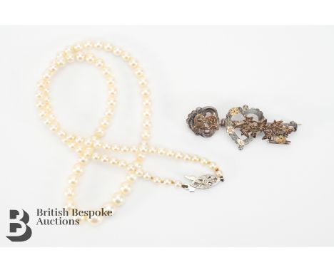 A vintage graduated pearl necklace on a 9ct gold and diamond clasp, approx 42 cms in length and the pearls from 2.5mm to 8mm 
