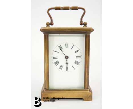 Brass carriage clock, having a white enamel face, Roman dial, approx 14 cms.&nbsp;