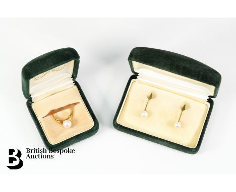 A 14ct yellow gold cultured pearl ring, size N. The pearl measures 8mm, approx 4 gms, together with a pair of pearl ear studs